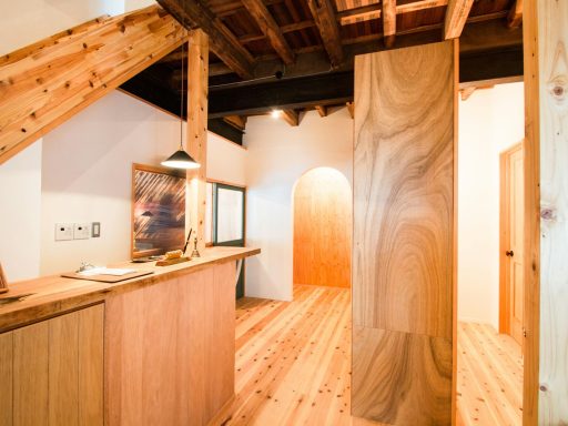 brown wooden desk beside palnk