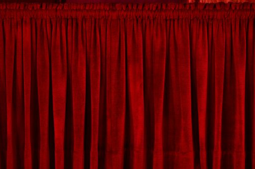 closeup photo of red rod pocket curtain