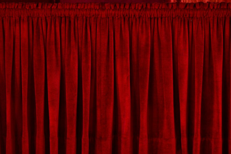 closeup photo of red rod pocket curtain