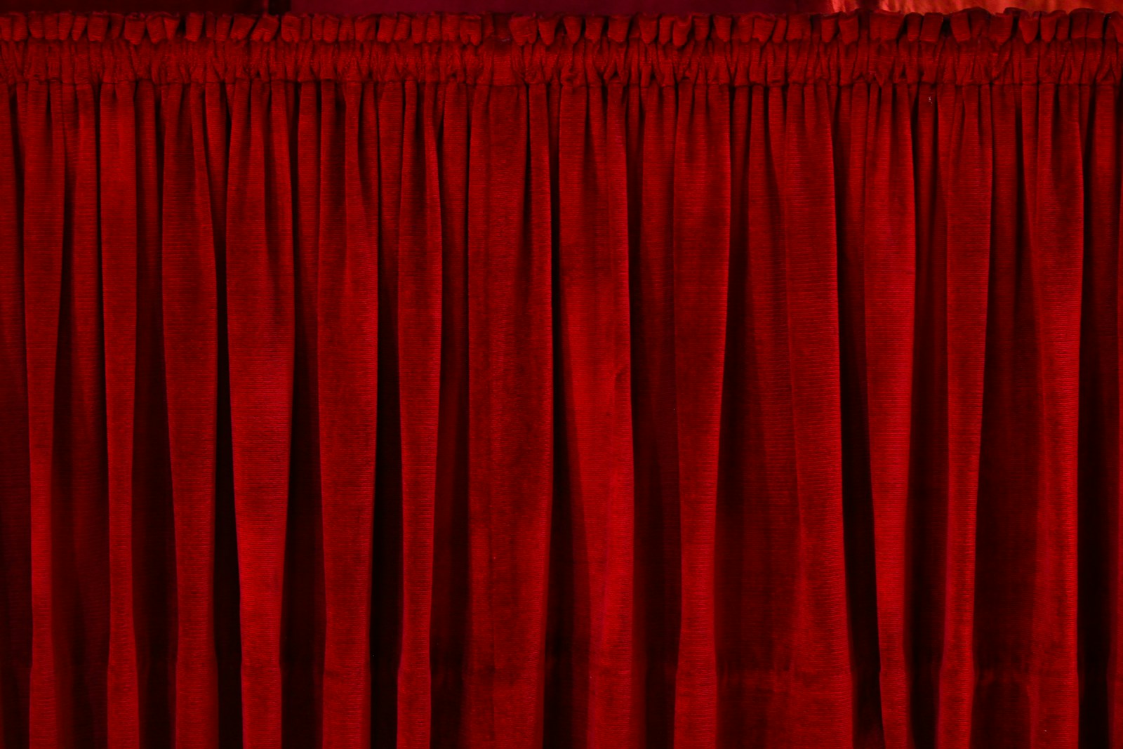 closeup photo of red rod pocket curtain
