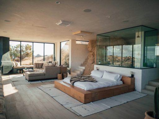 white mattress beside sectional sofa