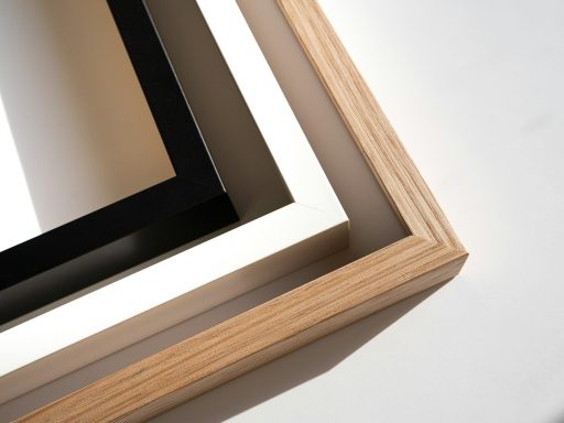 a wooden frame with a black and white picture in it